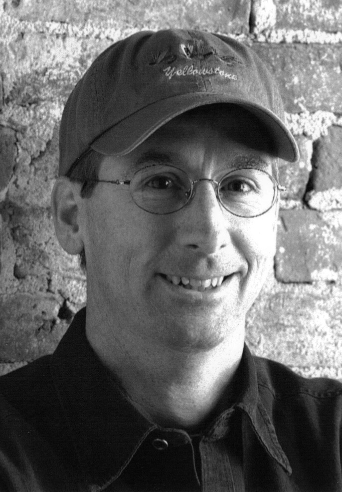 A black and white portrait head shot of artist Michael Albrechtsen